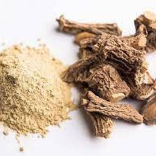 a pile of Hemidesmus Indicus powder and Hemidesmus Indicus root